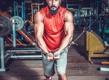 Body Builder Working Out At Gym